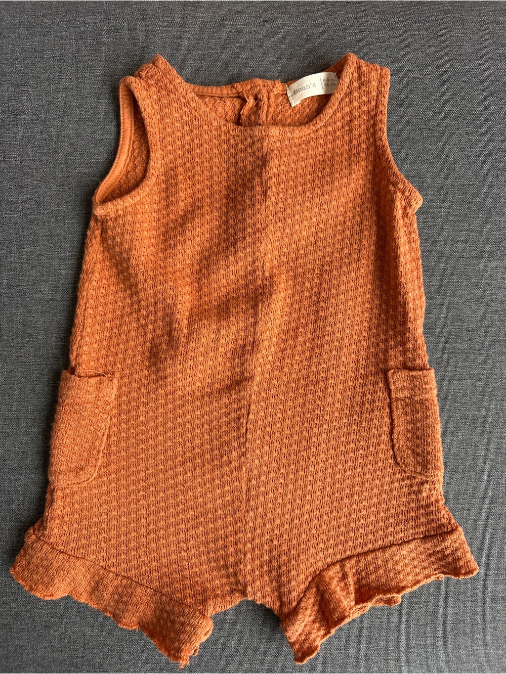 Girls Waffle Knit Orange Romper with Ruffle Hem